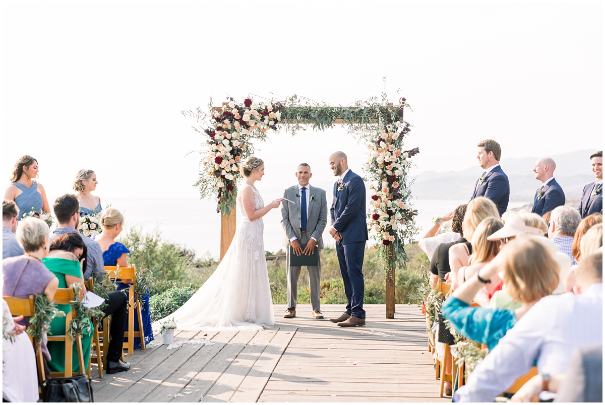 Ceremony overlooking the ocean | Dos Pueblos Orchid Farm Wedding in Santa Barbara by Peter and Bridgette